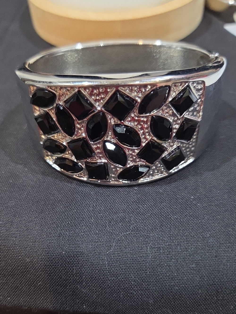 SILVER-TONE CUFF BRACELET WITH BLACK FACETED STONES